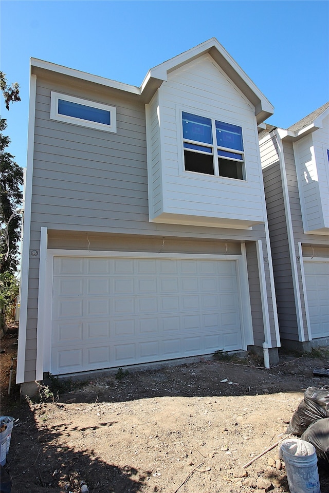 front facade with a garage