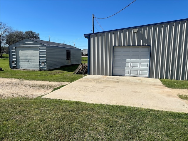 garage featuring a yard