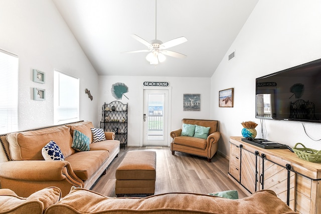 living room with high vaulted ceiling, light hardwood / wood-style floors, and ceiling fan