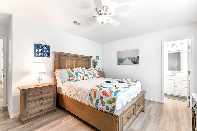 bedroom with ensuite bath, ceiling fan, and light wood-type flooring