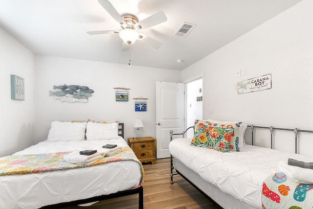 bedroom featuring ceiling fan and light wood-type flooring