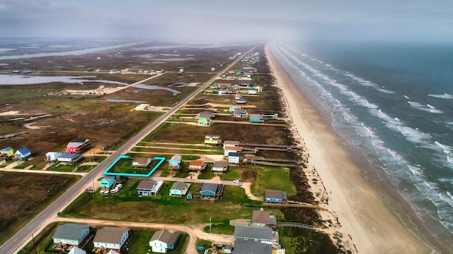 aerial view featuring a water view and a view of the beach