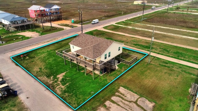 birds eye view of property with a rural view