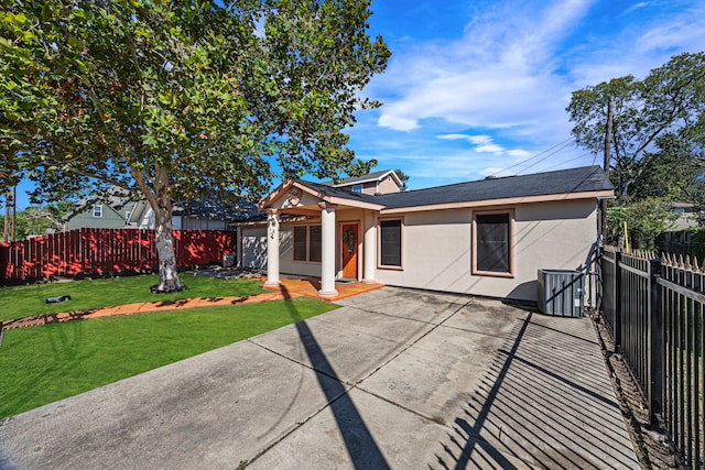 ranch-style house featuring a patio and a front yard