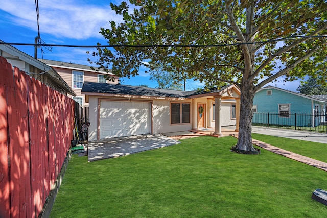 view of front of home featuring a front lawn and a garage