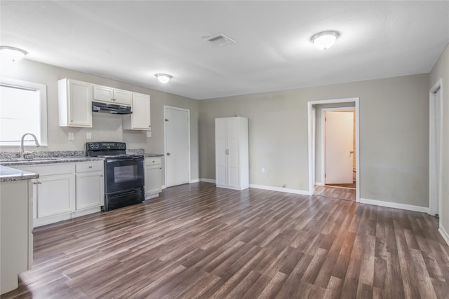 kitchen with black range with electric stovetop, white cabinetry, dark hardwood / wood-style floors, and sink