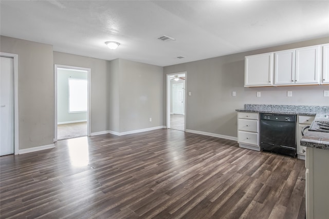 kitchen featuring black dishwasher, light stone countertops, white cabinets, and dark hardwood / wood-style floors