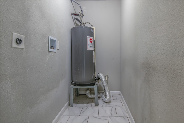 utility room featuring electric water heater