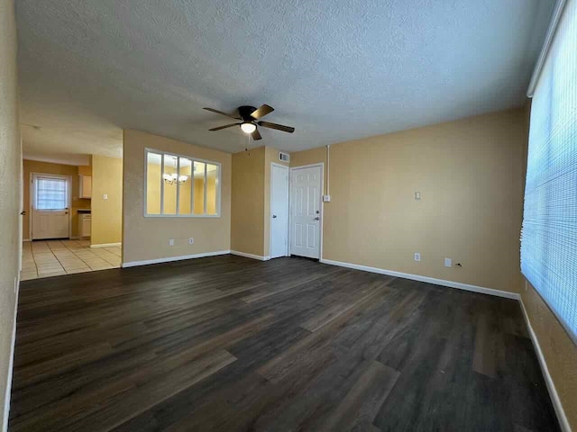 unfurnished room featuring ceiling fan, a textured ceiling, and hardwood / wood-style floors