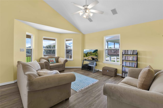 living room with a healthy amount of sunlight, ceiling fan, and light hardwood / wood-style flooring