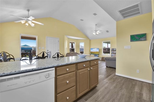 kitchen with light hardwood / wood-style flooring, white dishwasher, vaulted ceiling, and ceiling fan