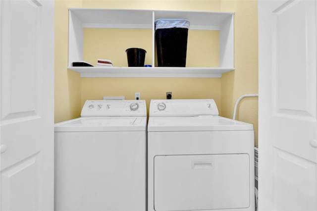 clothes washing area featuring washing machine and dryer