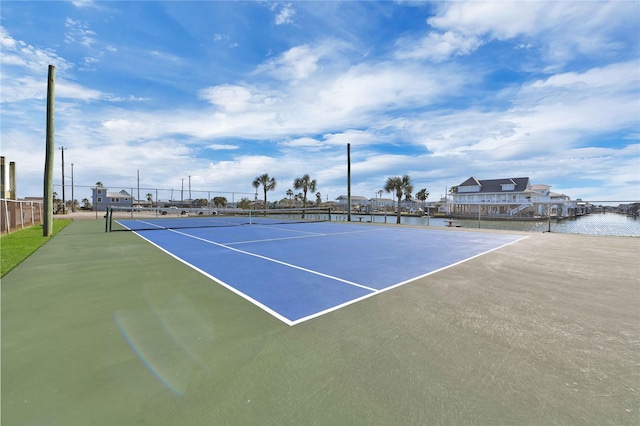 view of tennis court with fence