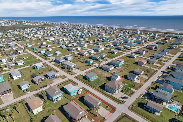 birds eye view of property with a residential view and a water view