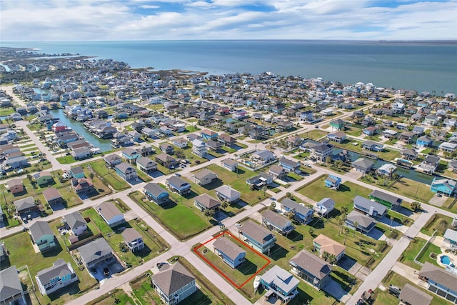 birds eye view of property featuring a water view and a residential view
