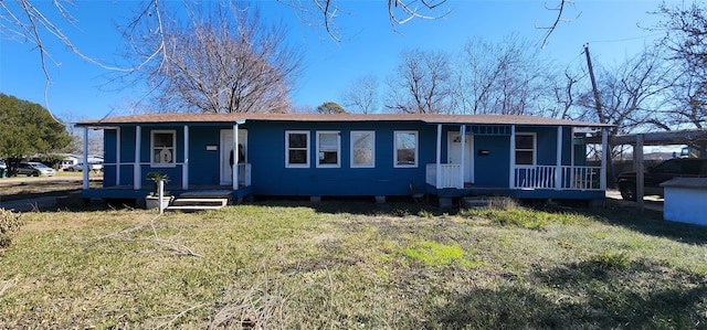 view of front facade with a front lawn and a porch