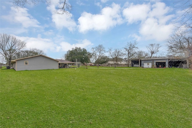 view of yard with a garage