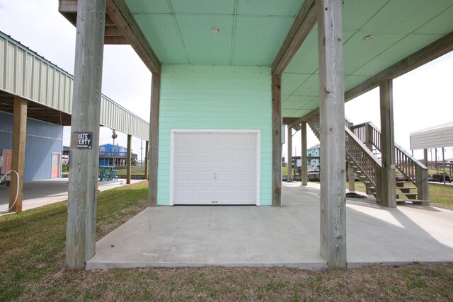 view of patio featuring a garage