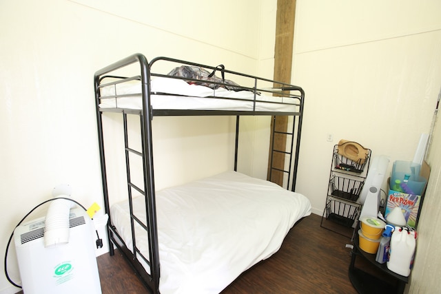 bedroom featuring dark hardwood / wood-style flooring