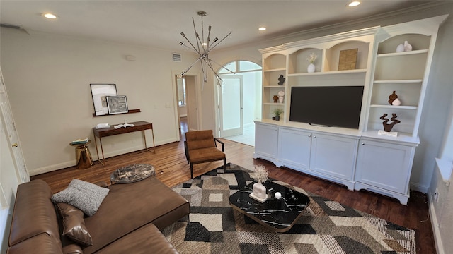 living room with ornamental molding and wood-type flooring