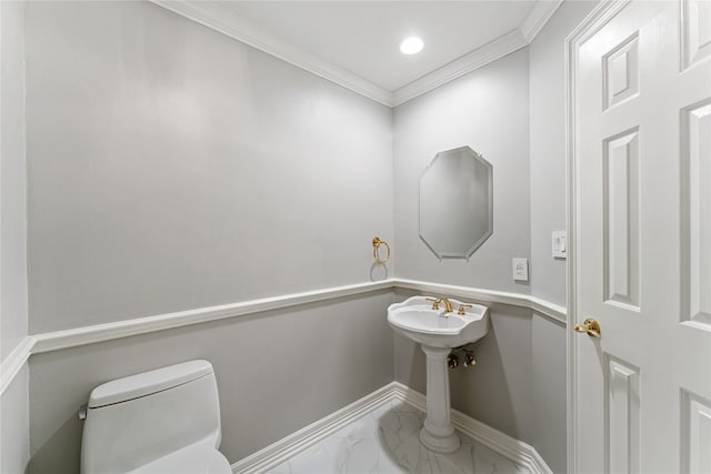 bathroom with ornamental molding and toilet