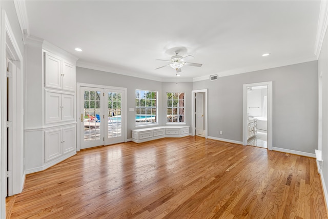 unfurnished living room with crown molding, ceiling fan, and light hardwood / wood-style floors