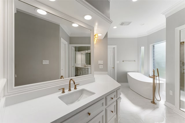 bathroom featuring vanity, a bathtub, and crown molding