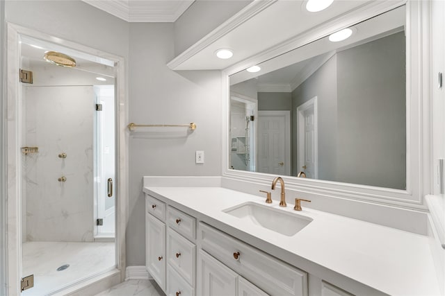 bathroom with crown molding, vanity, and an enclosed shower