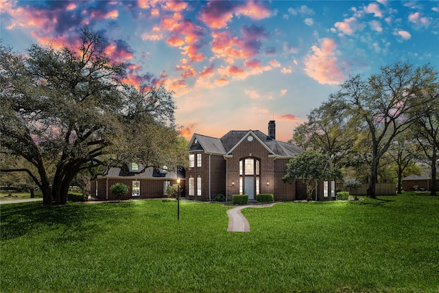 view of front of home with a yard