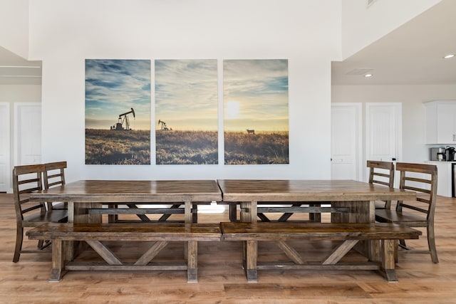 dining area with hardwood / wood-style floors