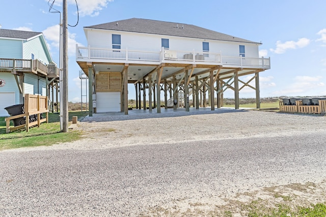 back of house with a carport