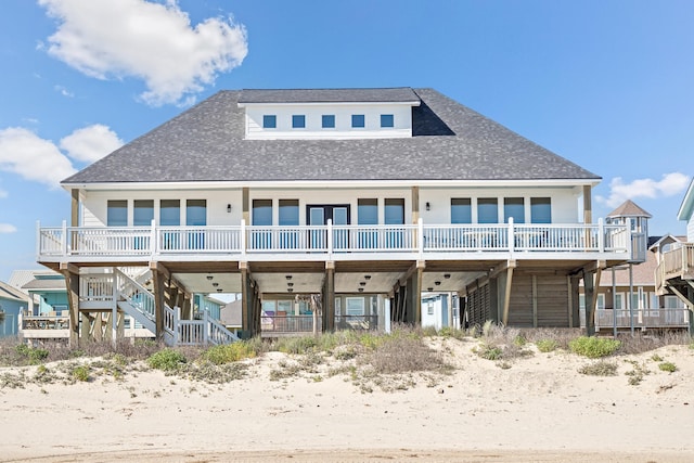 back of house with a wooden deck