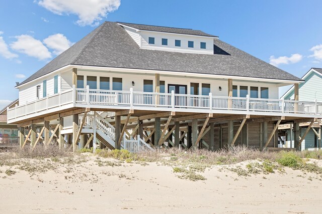 back of house featuring a deck