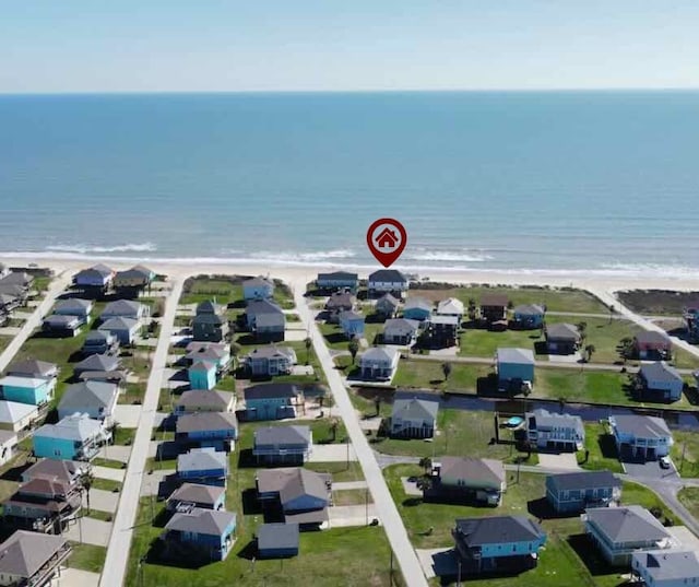 bird's eye view featuring a beach view and a water view