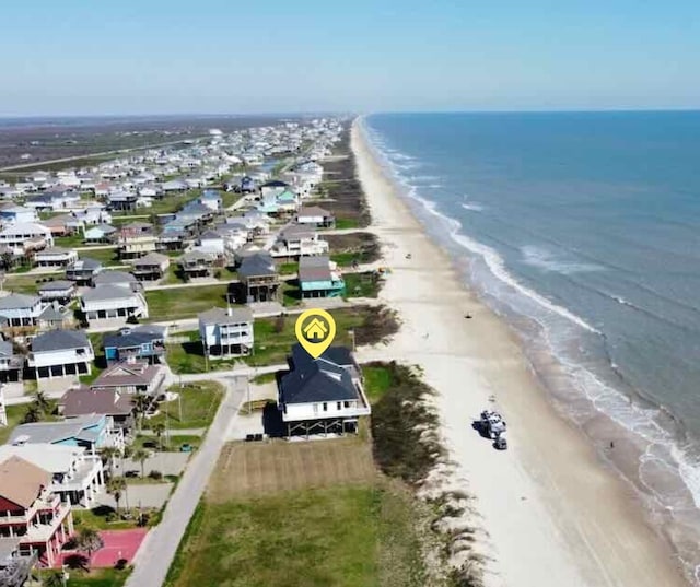 bird's eye view featuring a view of the beach and a water view