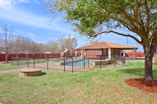 view of property's community with a patio area, a gazebo, a swimming pool, and a lawn