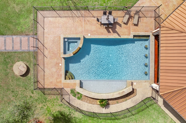 view of swimming pool with a patio area