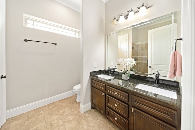 bathroom featuring toilet, walk in shower, vanity, and tile patterned floors