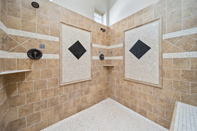 bathroom with tiled shower