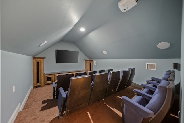 cinema featuring carpet floors and vaulted ceiling