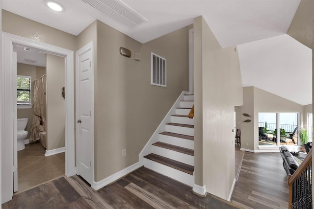 staircase with wood-type flooring