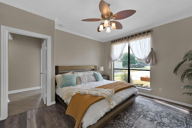 bedroom featuring ceiling fan and dark hardwood / wood-style flooring