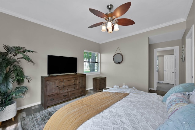 bedroom with dark hardwood / wood-style flooring, ceiling fan, and crown molding