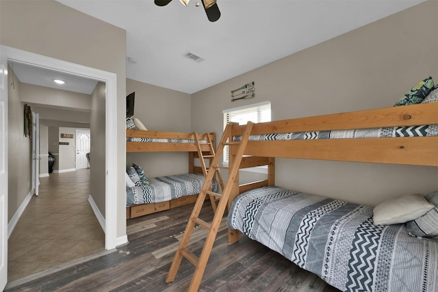 bedroom featuring ceiling fan and dark hardwood / wood-style floors