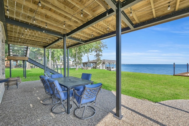 view of patio featuring a water view