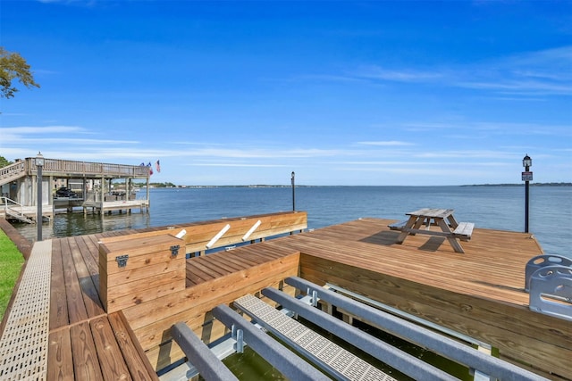 view of dock with a water view