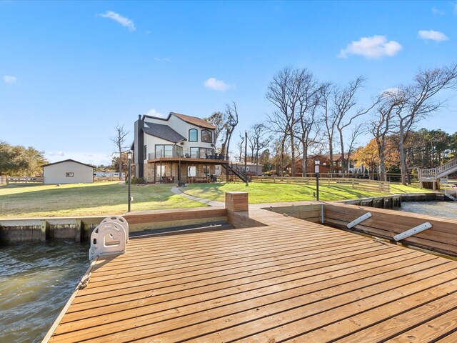 exterior space featuring a yard and a water view