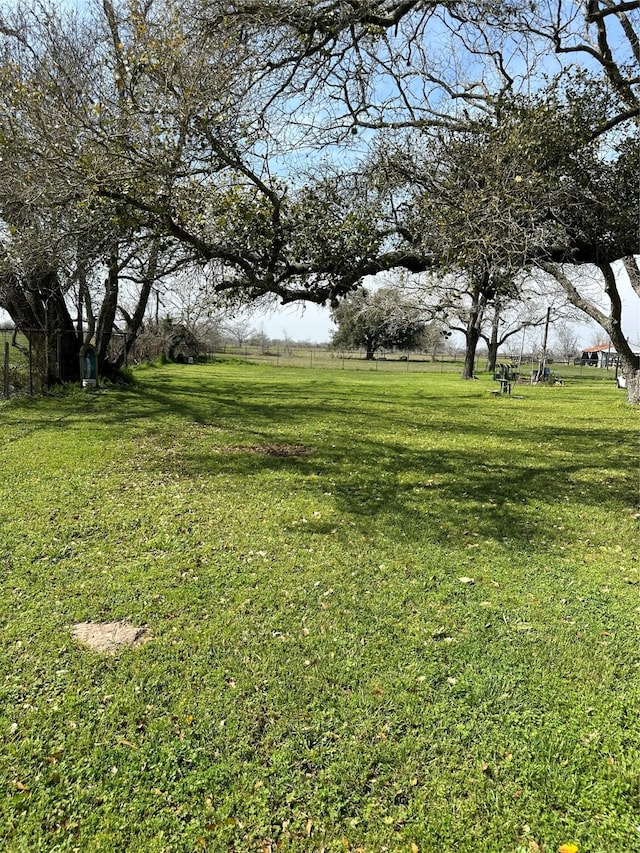 view of yard with a rural view