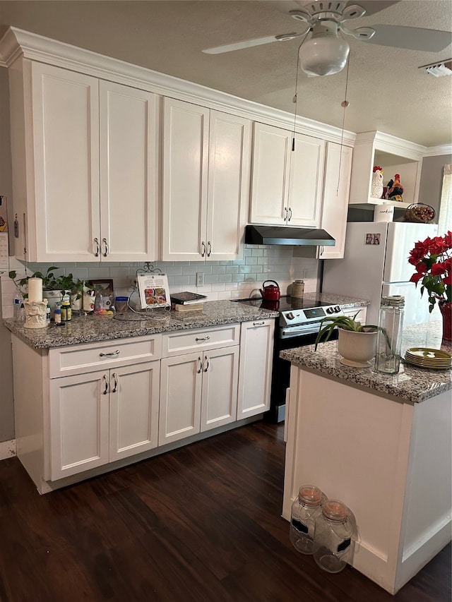 kitchen with ceiling fan, dark hardwood / wood-style flooring, white cabinets, electric range oven, and tasteful backsplash