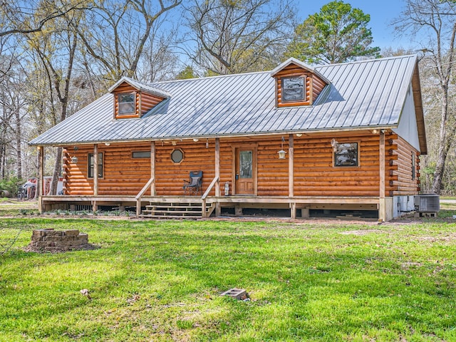 exterior space featuring a yard and central AC unit